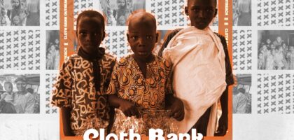 Three young children stand together holding clothing packages during Colgar's Cloth Bank Outreach in Kwara State, Nigeria, with a background highlighting past outreach events.